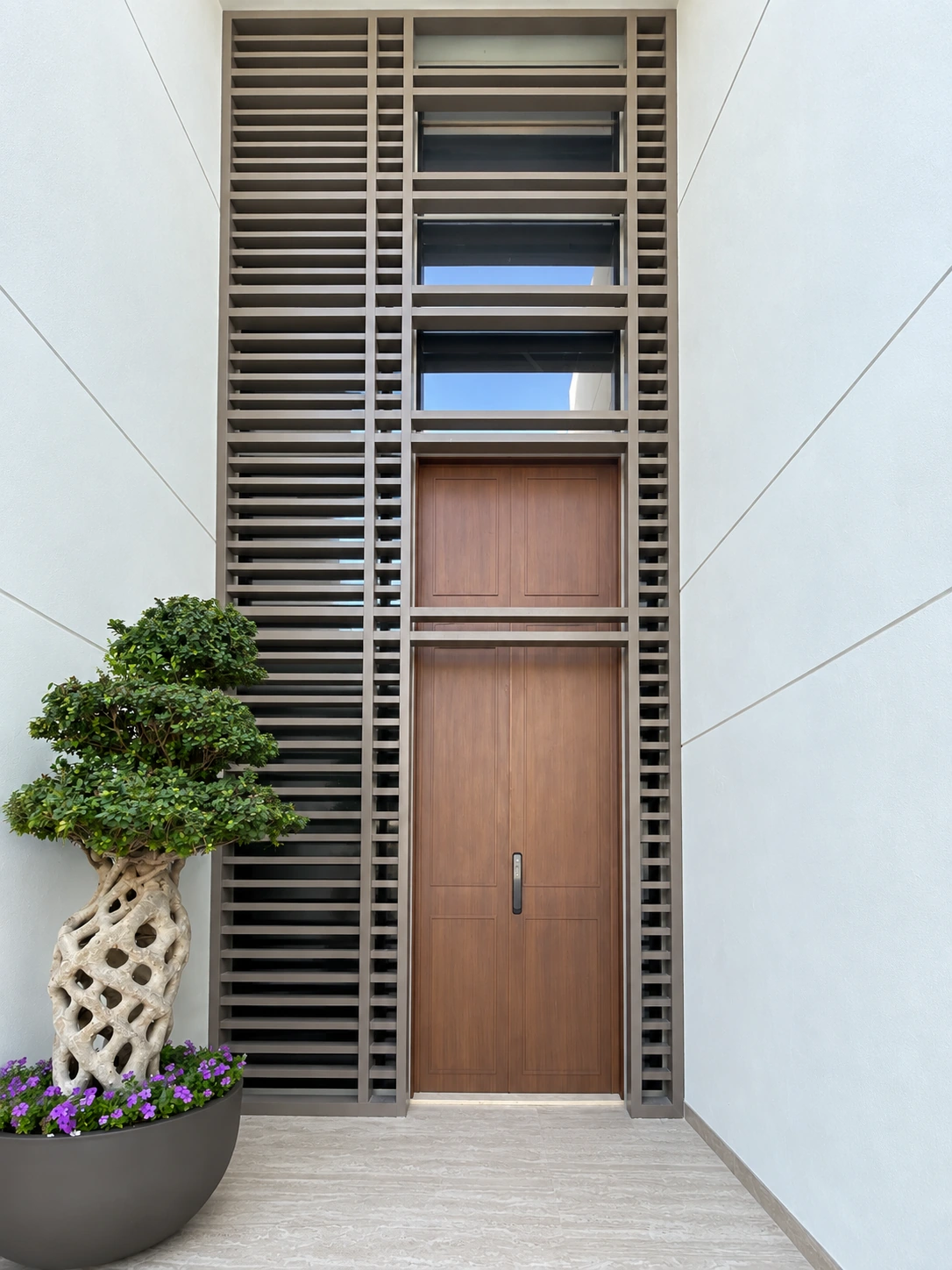 Aluminum door with wood finish and smart lock